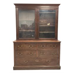 19th century mahogany display cabinet, the projecting cornice over two glazed doors enclosing four adjustable shelves, over four short and one long drawer, raised on a plinth base 