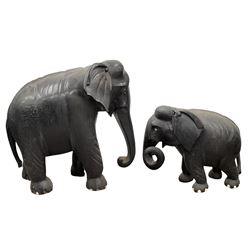Large Indian carved and ebonised wood elephant H66cm x L64cm and a smaller similar elephant H38cm x L44cm