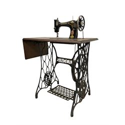 Singer sewing machine with cast iron treadle base